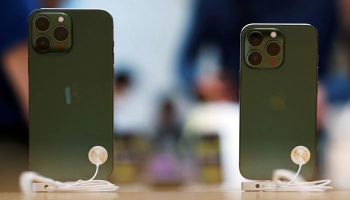 Apple iPhone 13 Pro models in the colour “alpine green” are displayed at an Apple shop in Singapore March 18, 2022. — Reuters/File