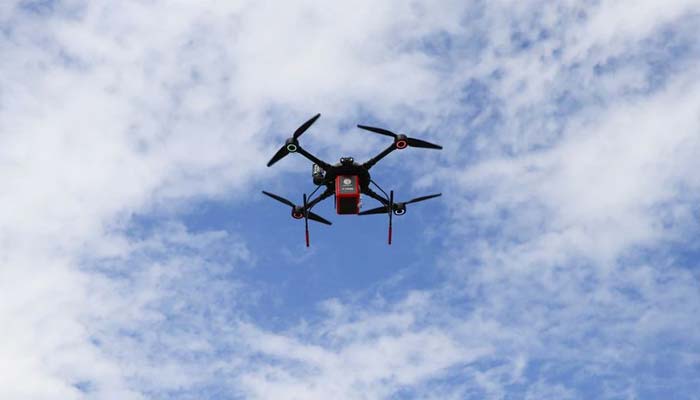 A medicines delivery drone flies outside a drugstore in Trikala, Greece September 21, 2021.— Reuters