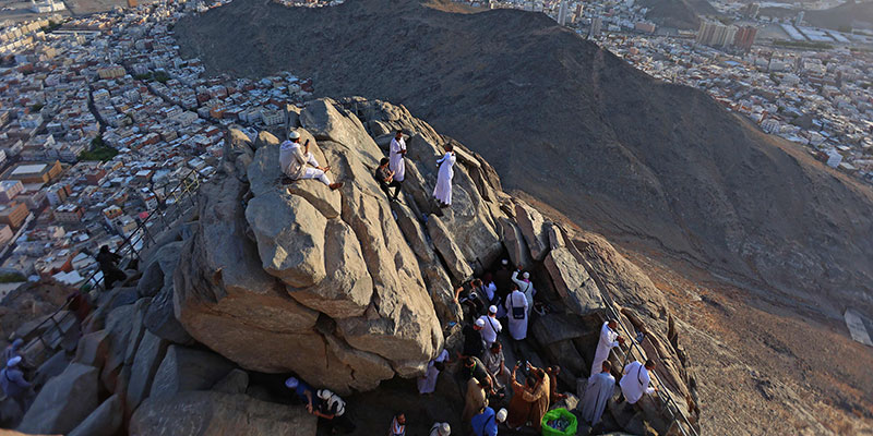 Pilgrims are pictured on the Jabal al-Noor 'mountain of light', overlooking the holy city of Mecca.  — AFP