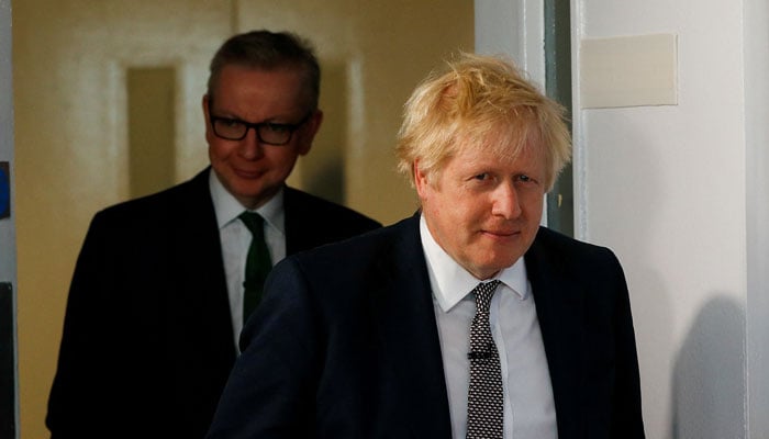 Britains Prime Minister Boris Johnson and Chancellor of the Duchy of Lancaster Michael Gove arrive to a news conference in London, Britain November 29, 2019. — Reuters/File