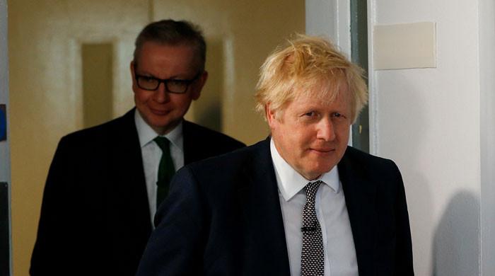 Boris Johnson clings on despite clamour for his resignation