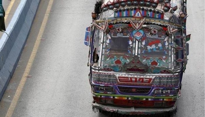 A public bus on Karachi Shahrah e Faisal  — Reuters