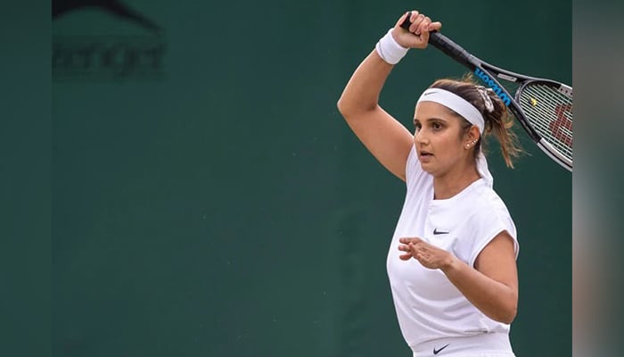 Indian tennis ace Sania Mirza serves during the Wimbledon Championship. — Twitter/MirzaSania