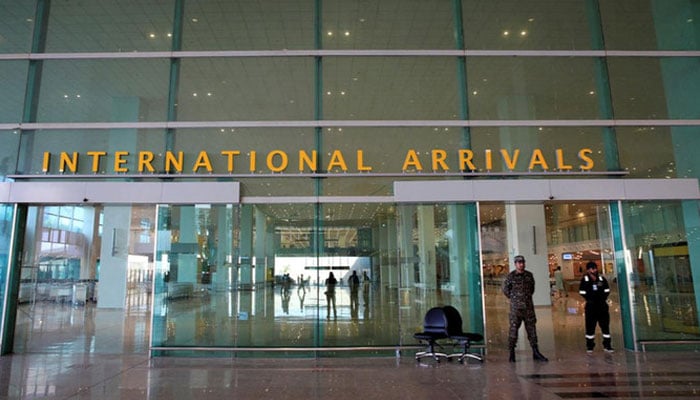 Airport Security Force personnel stand guard at the international arrivals area of Islamabad International Airport, April 18, 2018. — Reuters/File