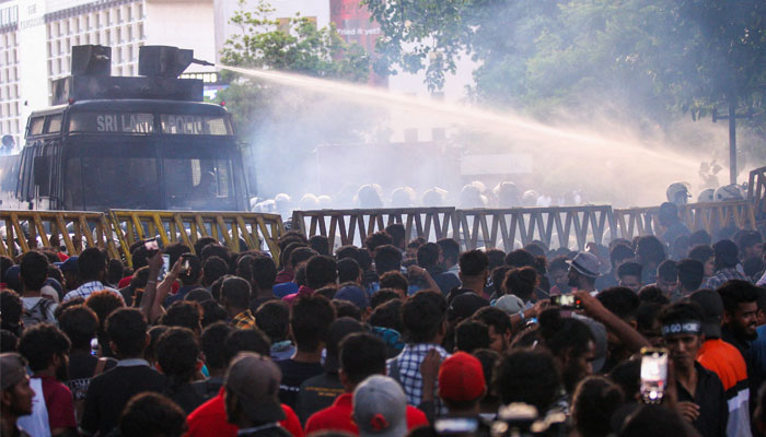 Police use a water canon to disperse demonstrators taking part in an anti-government protest demanding the resignation of Sri Lankas President Gotabaya Rajapaksa over the countrys crippling economic crisis, in Colombo on July 8, 2022. — AFP