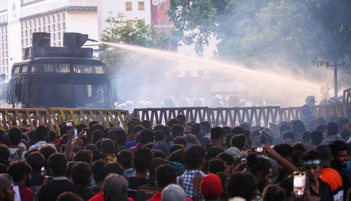 Police use a water canon to disperse demonstrators taking part in an anti-government protest demanding the resignation of Sri Lanka´s President Gotabaya Rajapaksa over the country´s crippling economic crisis, in Colombo on July 8, 2022. AFP