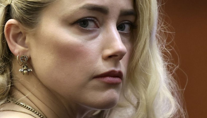 Amber Heard ‘risking everything’ with tell-all book?