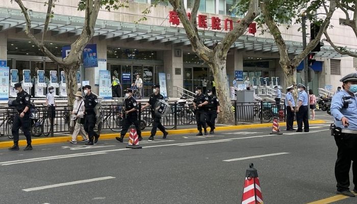 Police officers walk outside the outpatient department of Ruijin Hospital following a stabbing incident, in Shanghai, China July 9, 2022.— Reuters