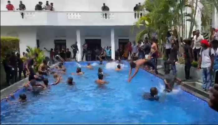 Sri Lankan protestors at the presidents official residence. — Screengrab via Twitter/Imtiaz Buhardeen