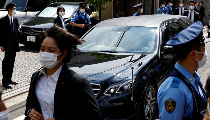 A vehicle believed to be carrying the body of former Japanese Prime Minister Shinzo Abe who was shot while campaigning for a parliamentary election, arrives at his residence in Tokyo, Japan July 9, 2022. — Reuters