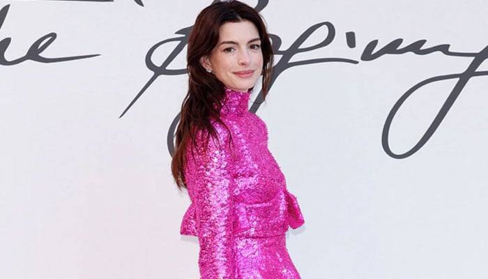 Anne Hathaway turns head in gorgeous hot pink dress at Valentino fashion show