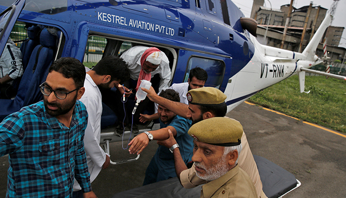 An injured is rushed for treatment after he was evacuated in a helicopter following a cloudburst near the holy Amarnath cave shrine, at the Sher-i-Kashmir Institute of Medical Sciences hospital in Srinagar on July 9, 2022. — Reuters