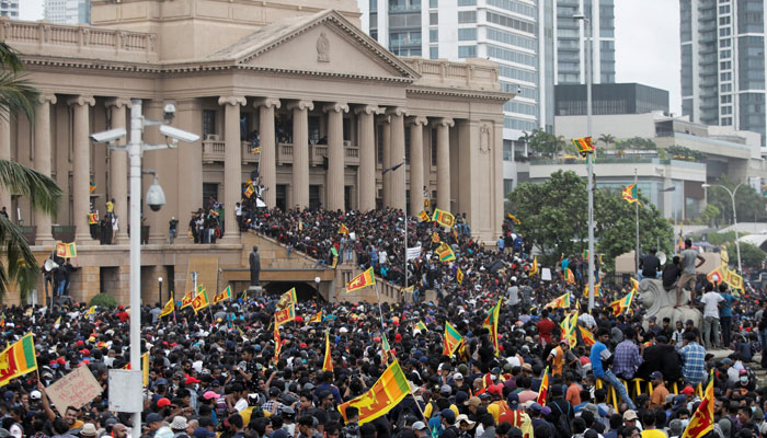 Demonstrators celebrate after entering into the Presidential Secretariat, after President Gotabaya Rajapaksa fled, amid the countrys economic crisis, in Colombo, Sri Lanka July 9, 2022. — Reuters