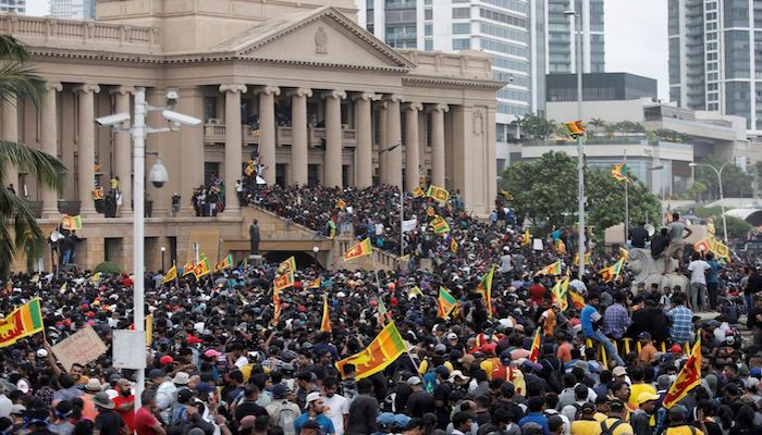 Demonstrators celebrate after entering into the Presidential Secretariat, after President Gotabaya Rajapaksa fled, amid the countrys economic crisis, in Colombo, Sri Lanka July 9, 2022. Photo: Reuters