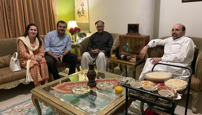 Federal Minister for Planning and Development Ahsan Iqbal pictured with the family who paid him a visit at his Narowal residence. — Photo courtesy betterpakistan/Twitter