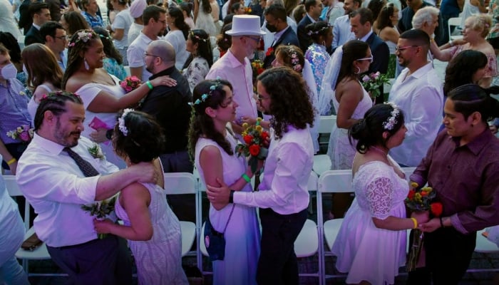 Couples get married during a mass wedding for COVID-delayed couples at Lincoln Center in New York City on July 10, 2022. — AFP/File