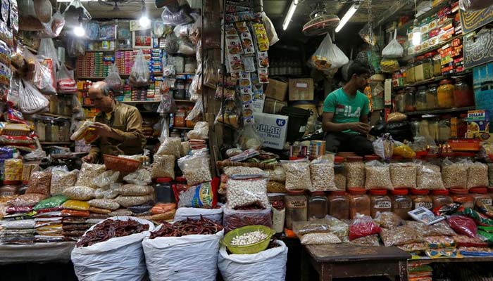 Vendors wait for customers at their respective shops at a retail market in Kolkata, India, December 12, 2018. &mdash; Reuters/File