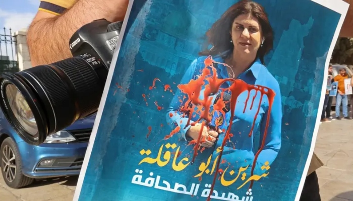 A Palestinian journalist protests the death of veteran Al-Jazeera journalist Shireen Abu Akleh, who was shot dead while covering an Israeli army raid in Jenin, in the West Bank biblical city of Bethlehem on May 11, 2022. &mdash; AFP/File