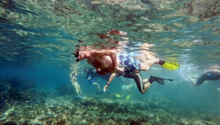 Visitors swim at the underwater archaeological park of the ancient port of Amathus in Limassol, Cyprus, July 9, 2022. — Reuters