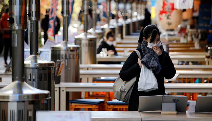 A woman wearing protective a face mask is seen at an open-air restaurant as the government declared the second state of emergency for the capital and some prefectures, amid coronavirus disease (COVID-19) outbreak, in Tokyo, Japan January 9, 2021. — Reuters