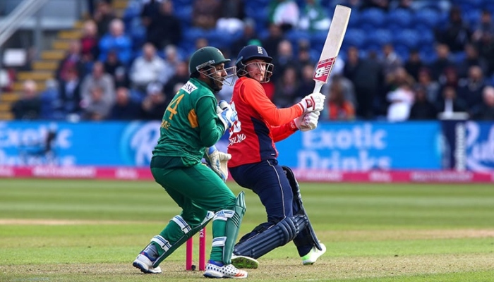 Englands Joe Root (R) plays a shot over the top of Sarfraz Ahmed during the international Twenty20 cricket match between England and Pakistan at Sophia Gardens in Cardiff. — AFP/File