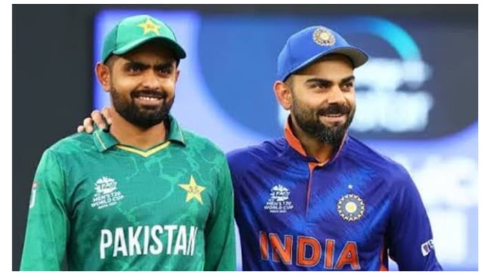 Pakistan team skipper Babar Azam (L) poses alongside former Indian cricket captain Virat Kohli. — Twitter/babarazam258