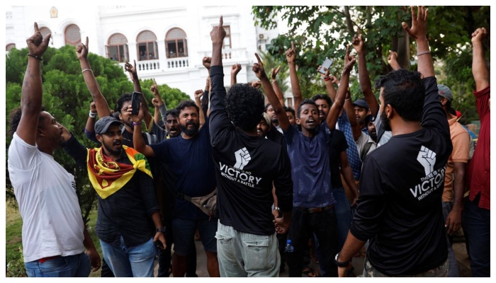 Protestors shout slogans as they vacate the Sri Lankas Prime Minister Ranil Wickremesinghes office, amid the countrys economic crisis, in Colombo, Sri Lanka July 14, 2022. — Reuters
