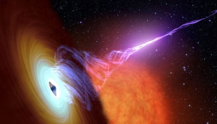This artists concept released October 30, 2017 shows a black hole with an accretion disk - a flat structure of material orbiting the black hole and a jet of hot gas, called plasma.— Reuters