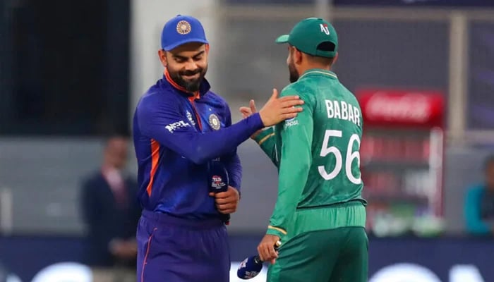 Former Indian skipper Virat Kohli (left) and Pakistan captain Babar Azam after the toss during the T20 World Cup. — Twitter/File