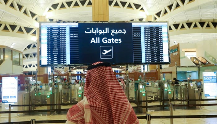A Saudi man checks the flight timings at the King Khalid International Airport in Riyadh, Saudi Arabia, May 16, 2021. — Reuters