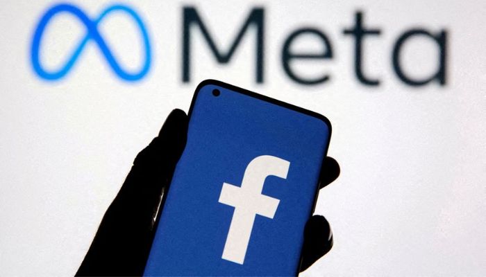 A smartphone with Facebooks logo is seen with new rebrand logo Meta in this illustration taken October 28, 2021. — Reuters