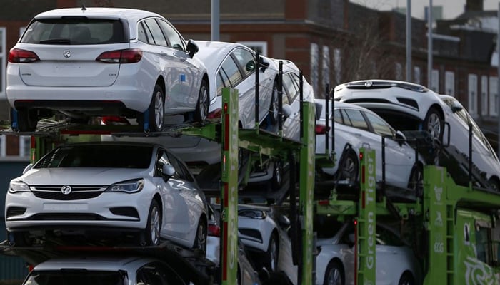 Vauxhall cars are transported on a lorry in Luton, Britain March 6, 2017.  — Reuters/File