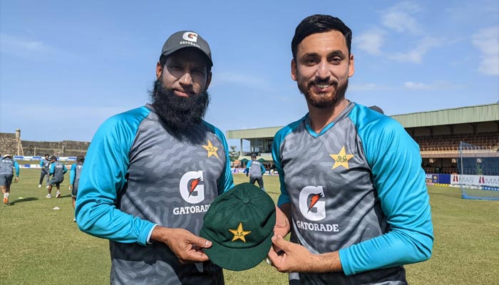 Batting coach Mohammad Yousuf (L) presents the debut cap to all-rounder Salman Ali Agha. — Pakistan Cricket Board