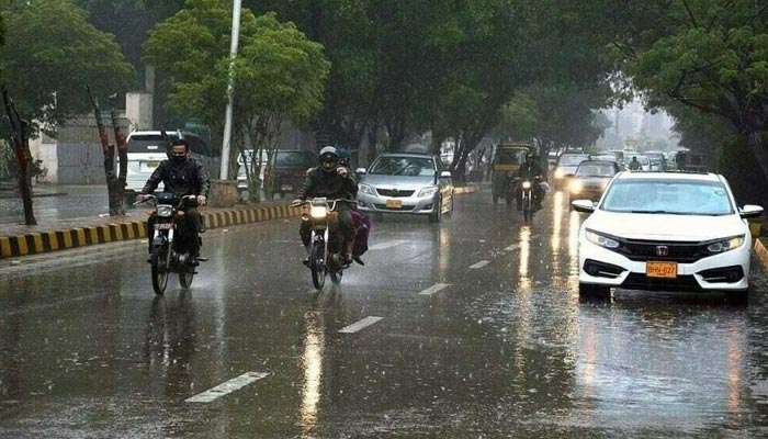 This image show vehicles on Karachis Abdullah Haroon Road during a spell of monsoon rain. — APP/ File