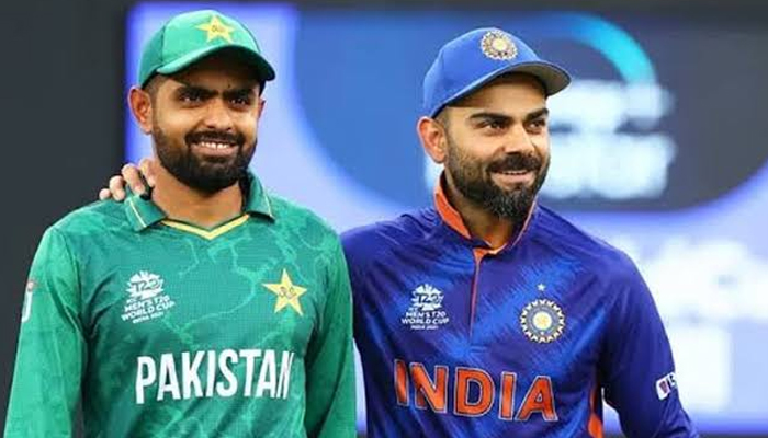 Pakistan team skipper Babar Azam (L) poses alongside former Indian cricket captain Virat Kohli. — Twitter/babarazam258