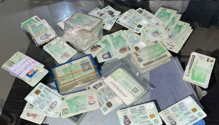 The identity cards which were recovered from the PTI worker in Lahore. — Geo News