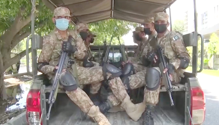 Pakistan Army troops can be seen in a military vehicle during reconnaissance at most sensitive constituencies ahead of the Punjab by-polls, on July 16, 2022. — ISPR
