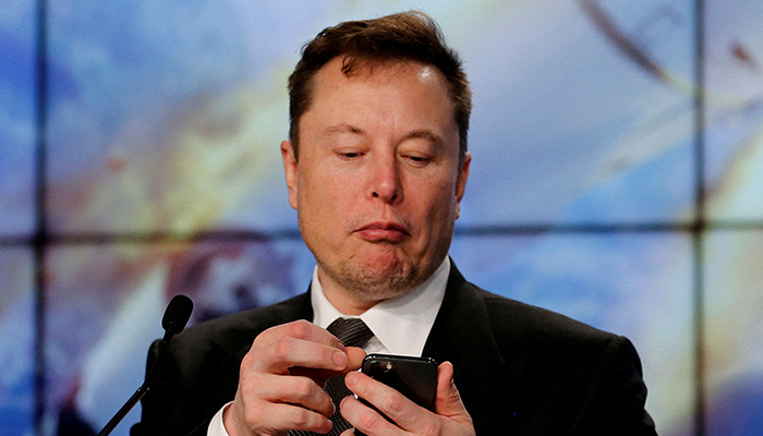 Elon Musk looks at his mobile phone in Cape Canaveral, Florida, US January 19, 2020. — Reuters