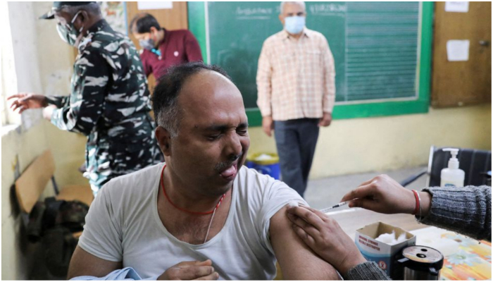A man reacts as he receives a dose of the COVISHIELD vaccine, against the coronavirus disease (COVID-19), manufactured by Serum Institute of India, at a vaccination centre in New Delhi, India, January 12, 2022. — Reuters/Anushree Fadnavis