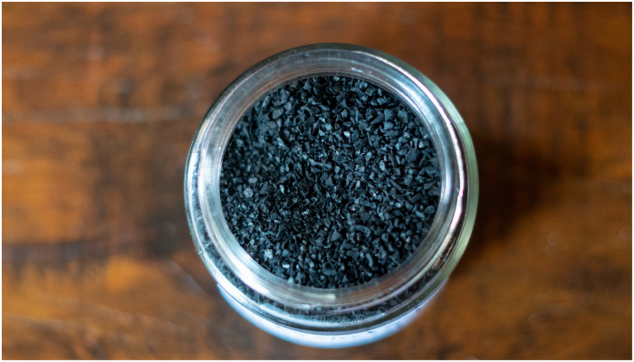 Image showing a jar containing activated charcoal. — Pixabay/ KawikaFilms