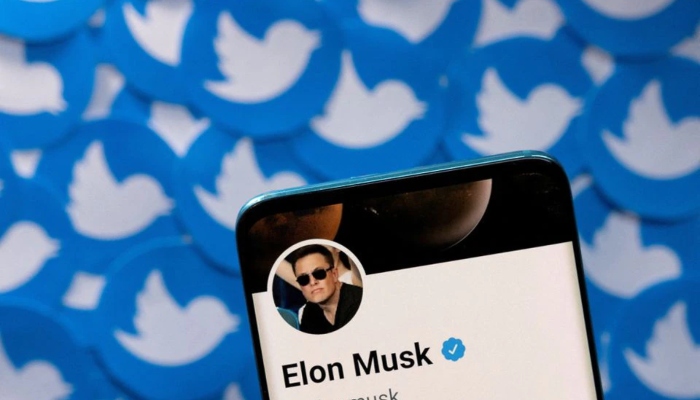 Elon Musks Twitter profile is seen on a smartphone placed on printed Twitter logos in this picture illustration taken April 28, 2022. — Reuters/File