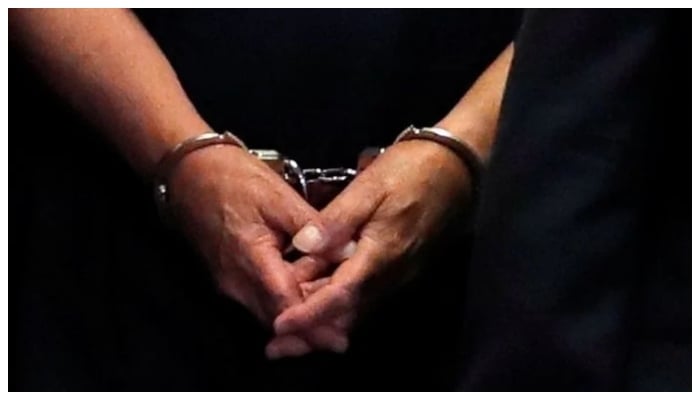 A Reuters file photo to represent a handcuffed man.