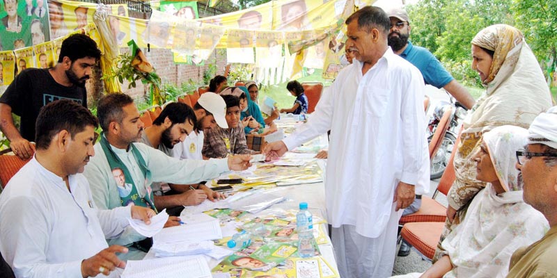 The ballot casting process is underway at a polling station during the Local Bodies Election, held in Lahore on Sunday, July 17, 2022. — PPI