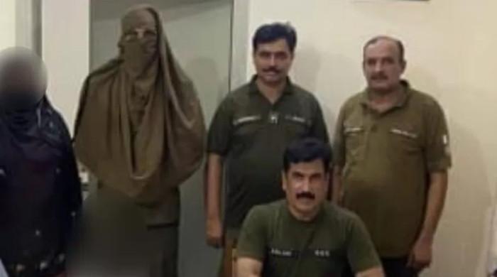 Policeman dresses up as lady constable to capture snap with arrested woman 