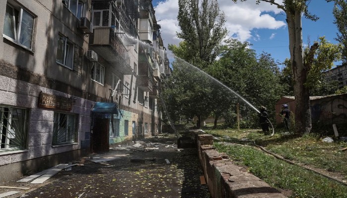 Firefighters work to put out a fire in a residential building after a Russian military strike, as Russias attack on Ukraine continues, in Kramatorsk, in Donetsk region, Ukraine July 19, 2022. REUTERS/Gleb Garanich