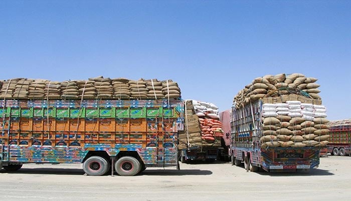 Pakistani trucks holding supplies stand parked in the Pakistan-Afghanistan border town of Chaman, before crossing to Afghanistan through the Friendship Gate crossing point — alt+ 0151 Reuters/File