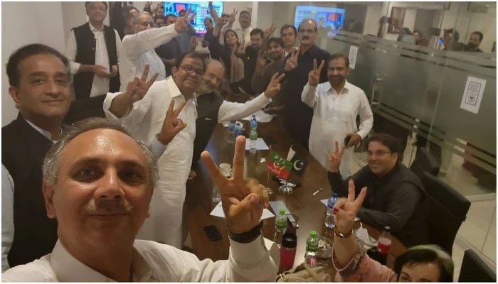 PTI workers celebrating after preliminary, unofficial results show the party securing a landslide victory in the Punjab by-polls, on July 17, 2022. — Twitter/Omar Ayub