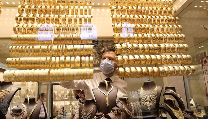 A representational image of a shopkeeper setting jewellery in the outlet. — Reuters/File