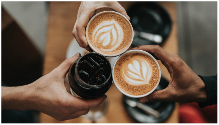 Representational image of people holding coffee cups. — Pixabay/StockSnap