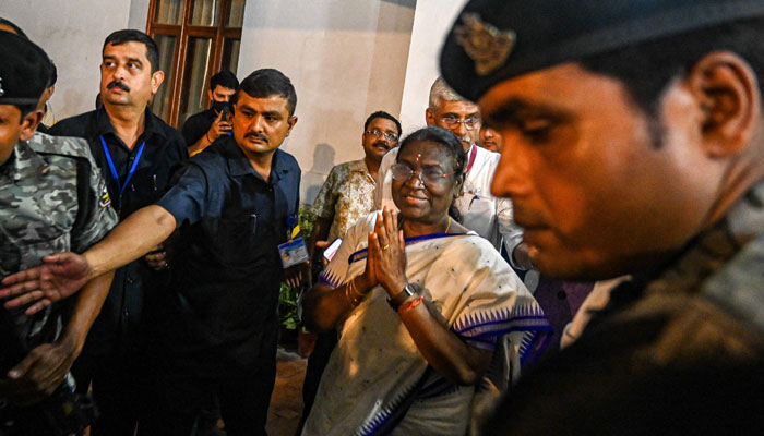 Indias President elect Droupadi Murmu (C) arrives at her temporary residence to greet her supporters after she was elected as countrys new president in New Delhi on July 21, 2022. — AFP
